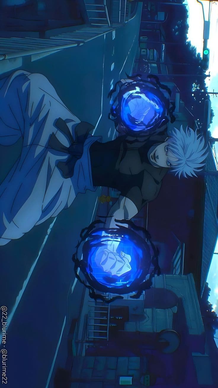 The image features a male character with spiky white hair and striking blue eyes, dressed in a dark, form-fitting high-neck top and light-colored traditional wide-leg trousers secured with a dark sash. He is captured in a dynamic, low-angle combat stance, lunging forward with both fists clenched and enveloped in swirling orbs of intense blue energy. The setting is a quiet, narrow urban street at dusk or night, with traditional Japanese-style houses and utility poles lining the background. The artistic style utilizes sharp linework and professional cel-shading, with a heavy emphasis on the glowing blue light cast by the energy orbs onto the character's face and clothing. The overall atmosphere is tense and powerful, conveying a sense of supernatural action and high-stakes confrontation. The composition uses a Dutch angle to enhance the feeling of movement and energy within the frame.