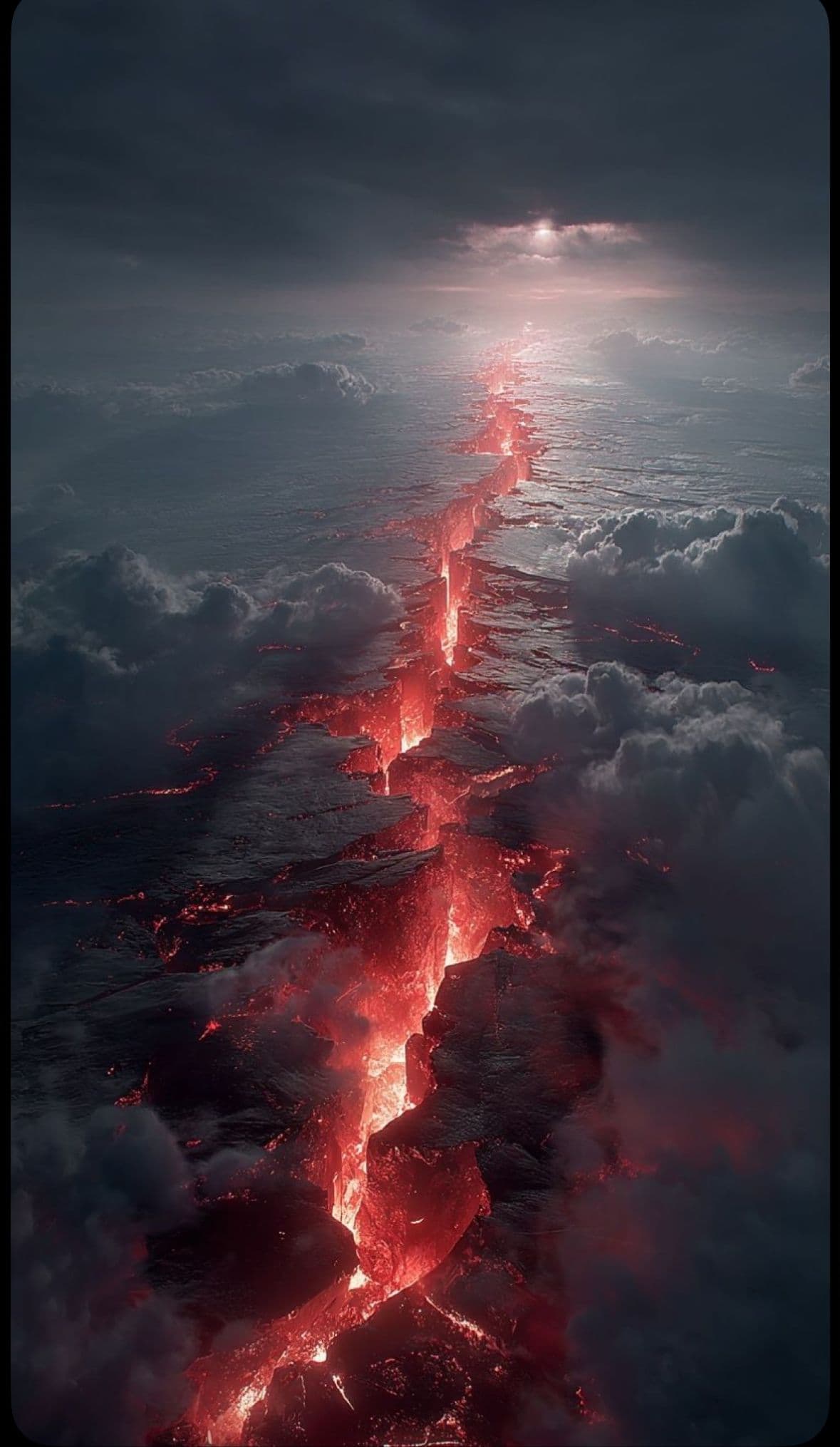 The image captures a dramatic aerial view of a massive, glowing volcanic fissure cutting through a sea of dark, stormy clouds. Lava flows with intense red and orange luminescence, illuminating the surrounding rock and cloud formations as it descends into the earth. The sky above is filled with heavy, textured clouds, pierced by a distant, pale sun that casts a soft, diffused glow over the scene. The composition emphasizes the raw power and scale of nature, with the fissure acting as a central, radiant axis. The overall atmosphere is awe-inspiring and slightly ominous, evoking a sense of natural majesty and impending geological force.
