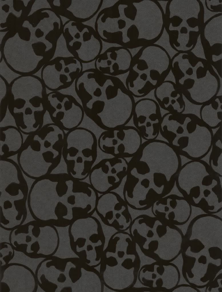 This image presents a dense, repeating pattern of stylized skull silhouettes rendered in solid black against a dark gray background. The skulls are uniformly simplified with minimal facial features, arranged in a chaotic yet balanced composition that fills the entire frame. The design evokes a gothic or macabre aesthetic through its repetitive, overlapping motif, creating a sense of visual rhythm and depth. The monochromatic palette and flat, graphic style emphasize the symbolic nature of the skulls without any narrative or character context. The overall impression is one of abstract symbolism rather than character depiction, lending a mysterious and slightly ominous tone to the wallpaper.