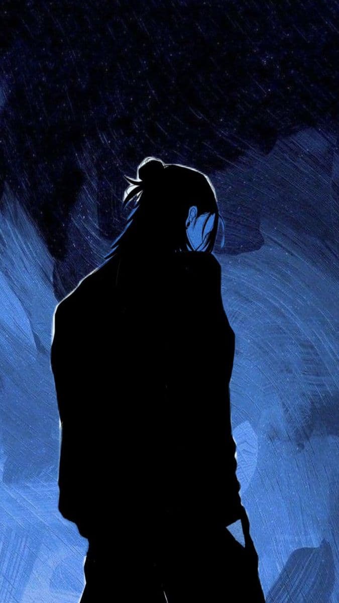 The image features a solitary figure viewed from behind, standing in a dark, rainy night under a star-filled sky. The character is clad in a long, dark garment that fully covers their body, with hair tied back in a high bun, suggesting a contemplative or introspective mood. The background is rendered with dynamic brushstrokes of deep blue and indigo, conveying the motion of falling rain and the vastness of the night. The lighting is minimal, relying on ambient glow and subtle highlights on the character's shoulder and ear, creating a strong silhouette. The overall atmosphere is somber, mysterious, and emotionally resonant, evoking themes of solitude and quiet reflection.