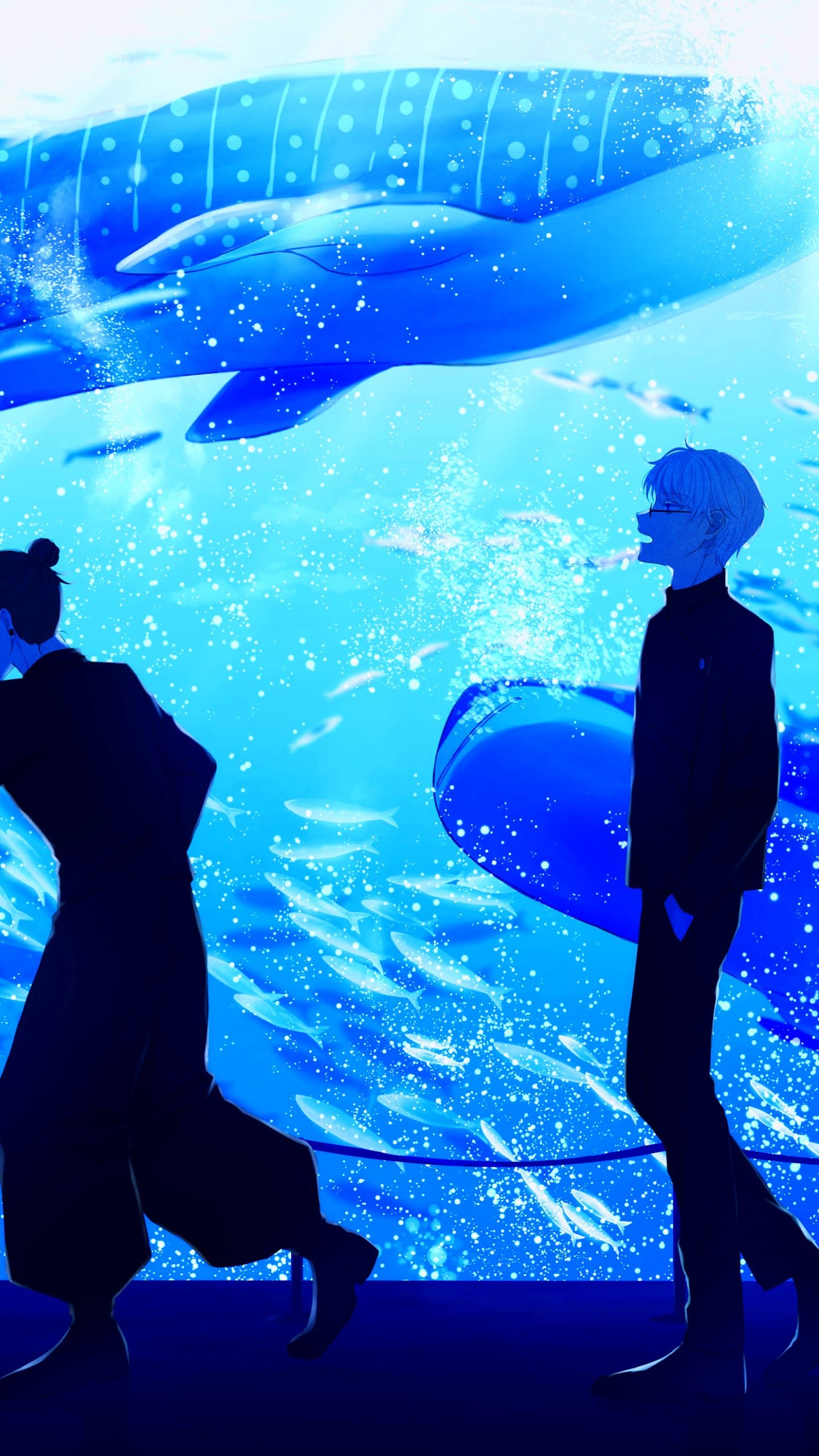 The image depicts two male figures, Satoru Gojo and Suguru Geto from Jujutsu Kaisen, standing before a massive aquarium tank. Both characters are dressed in their dark, high-collared jujutsu high uniforms, which provide full coverage and a sleek silhouette. Gojo is seen in profile on the right, wearing his signature round glasses and looking upward with a slight smile, while Geto is positioned on the left, partially turned away with his hair in a traditional bun. A magnificent whale shark dominates the upper portion of the frame, surrounded by schools of smaller fish and shimmering bubbles that create a sense of movement. The artistic technique utilizes a heavy blue monochrome palette with high-contrast lighting, making the characters appear almost as silhouettes against the glowing water. The overall atmosphere is peaceful and nostalgic, capturing a quiet, contemplative moment of friendship within a vast, aquatic environment.
