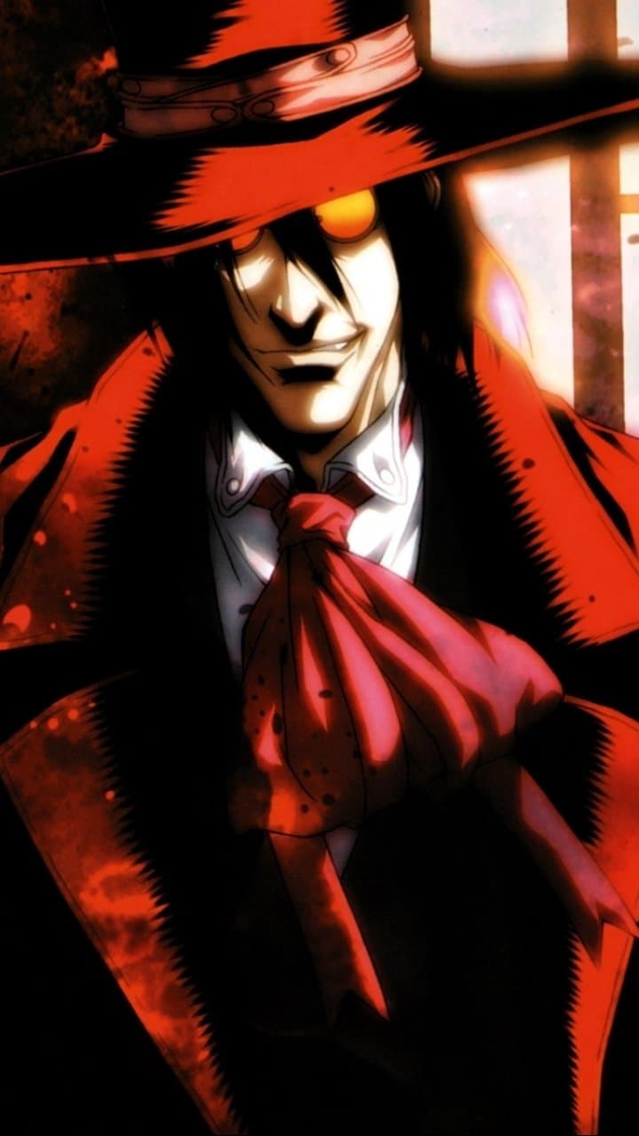 The image features Alucard from Hellsing, depicted in a striking medium shot. He is dressed in his signature charcoal suit, a white dress shirt, and a large red cravat, topped with a wide-brimmed red fedora that casts a deep shadow over his face. His expression is a menacing, wide-toothed grin, with glowing orange circular glasses that pierce through the darkness. The background is a hazy, textured blend of deep reds and blacks, suggesting a chaotic or supernatural environment. The artistic technique utilizes heavy contrast and dramatic chiaroscuro lighting to emphasize the character's intimidating presence. The overall atmosphere is dark, mysterious, and intensely powerful, capturing a sense of gothic horror.