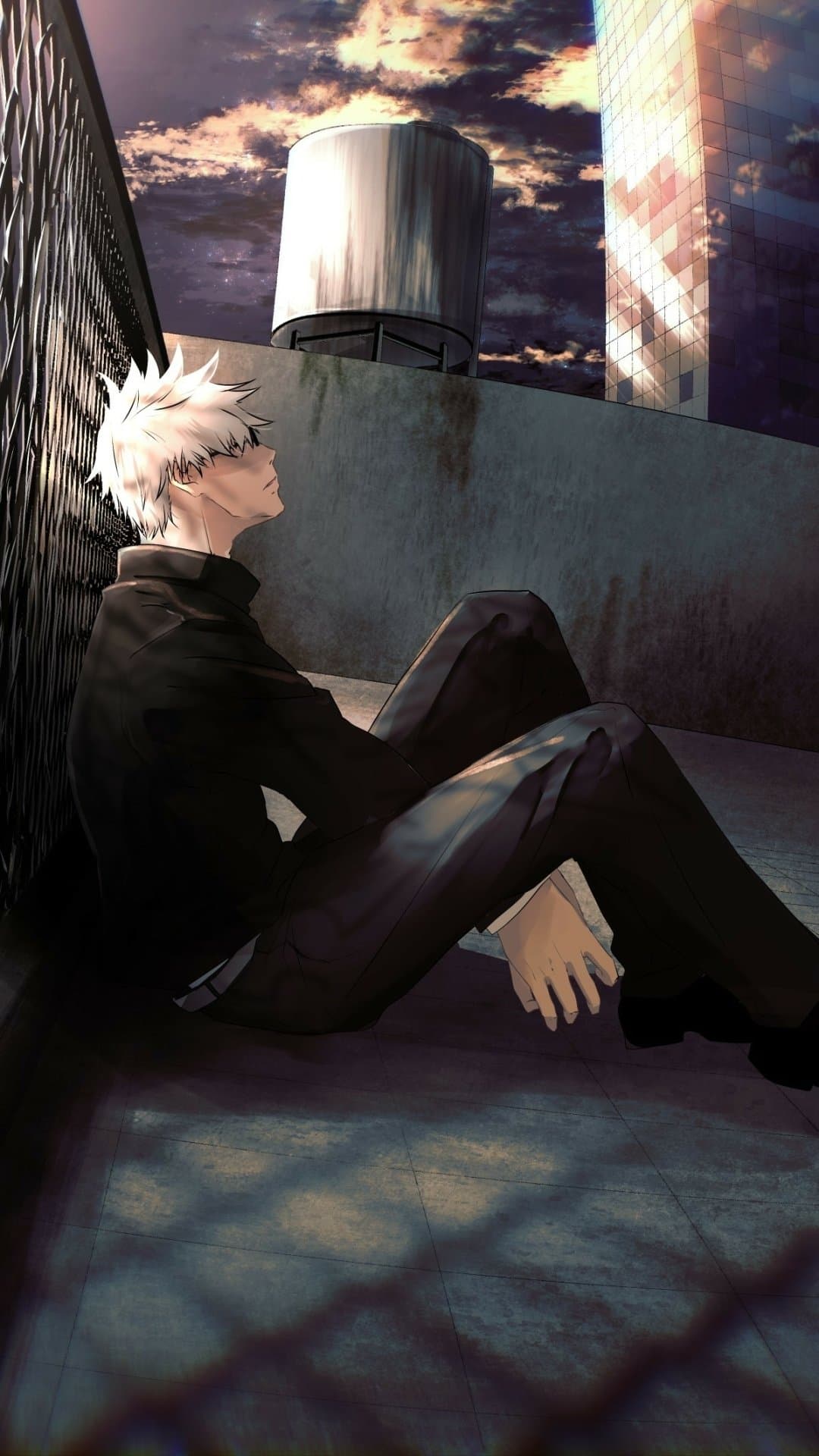The image features a young man with spiky white hair, identified as Satoru Gojo from Jujutsu Kaisen, dressed in a high-collared black jujutsu tech uniform. He is depicted in a seated, contemplative pose on a rooftop, leaning his back against a chain-link fence with his head tilted slightly upward and eyes closed. The setting is an urban rooftop during dusk or dawn, featuring a prominent water tower and a modern glass skyscraper reflecting the dramatic sky. The artistic technique utilizes sharp digital lines combined with painterly textures on the concrete surfaces and a highly detailed, cinematic sky. The overall atmosphere is one of quiet introspection and melancholy, emphasized by the long shadows and the contrast between the dark foreground and the vibrant, cloud-streaked horizon.